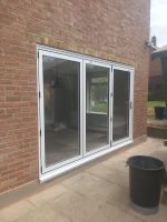 white aluminium bifold doors essex