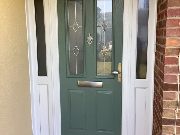 Dark green door with squares