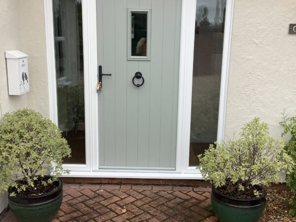 grey front door with knocker