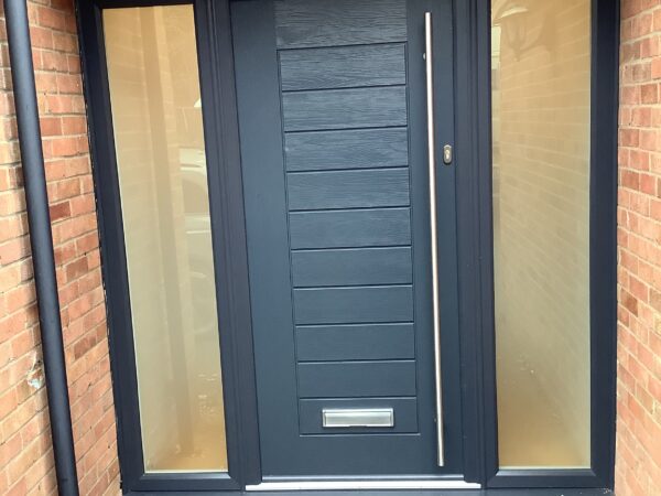 black front door with 2 side panels