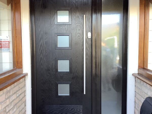 Black door featuring bold handle