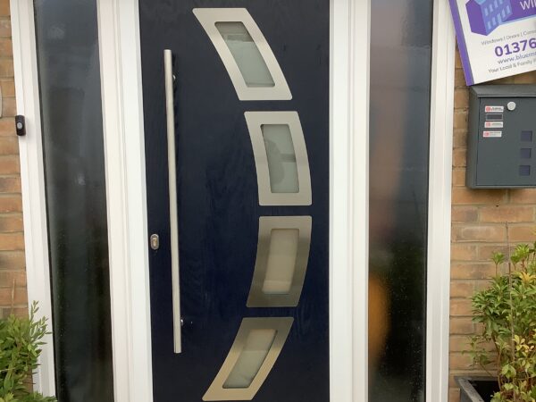 Black door with frosted circular window