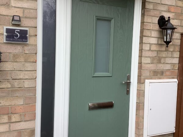 Dark green door with squares