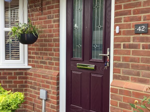 Brown door with intricate glasswork