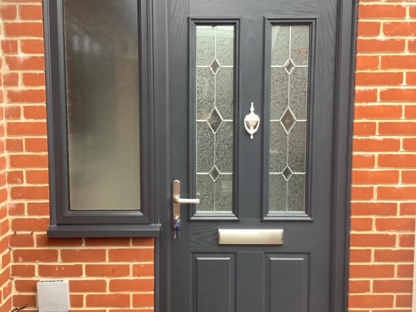 Black door with bold glass