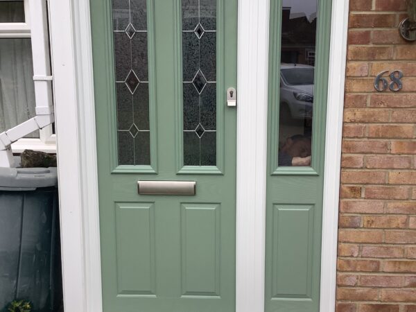 Green door with diamond glass