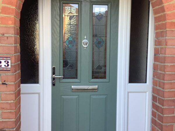 green door with enclosed porch