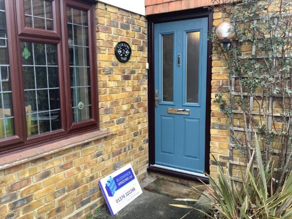 Blue door featuring frosted panel