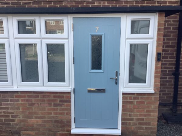 Blue painted door with windows