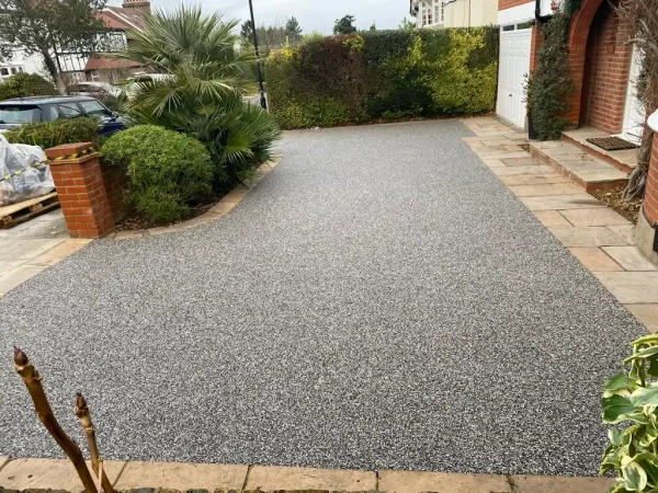 Premium resin driveway installation at a property in Braintree, Essex by Bluemanor Windows.