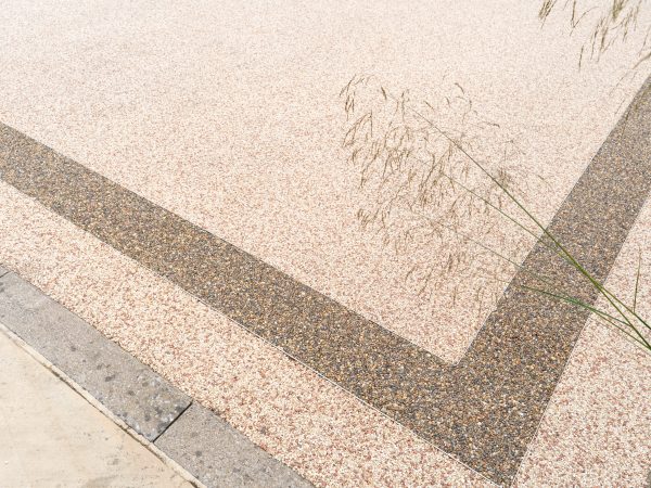 Close-up of Vuba resin bound stone surface with border installed in Essex