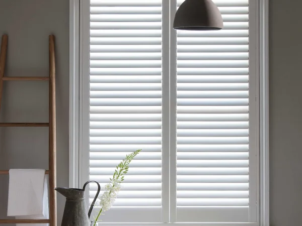 Bluemanor Windows full-height plantation shutters fitted to a home office window.
