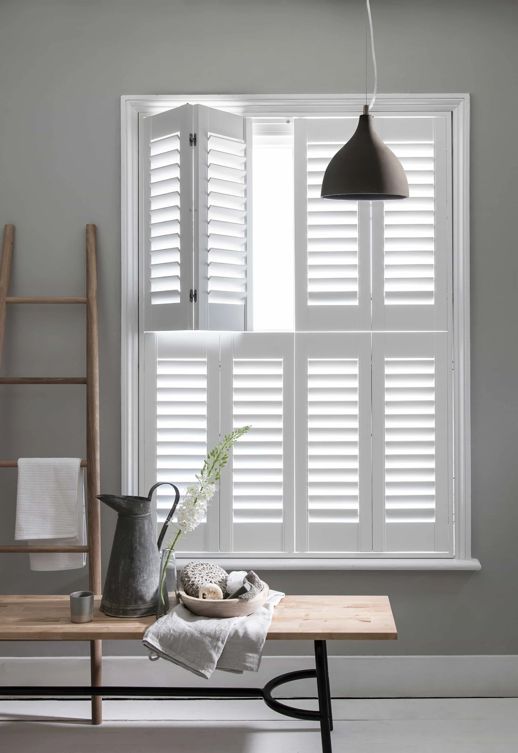 Bluemanor Windows tier-on-tier plantation shutters fitted to a sash-style window.